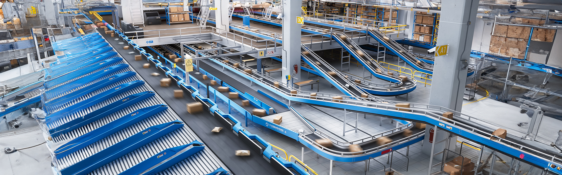 types of intralogistics conveyor systems in modern warehouse including belt conveyors, roller conveyors, and pallet handling conveyors