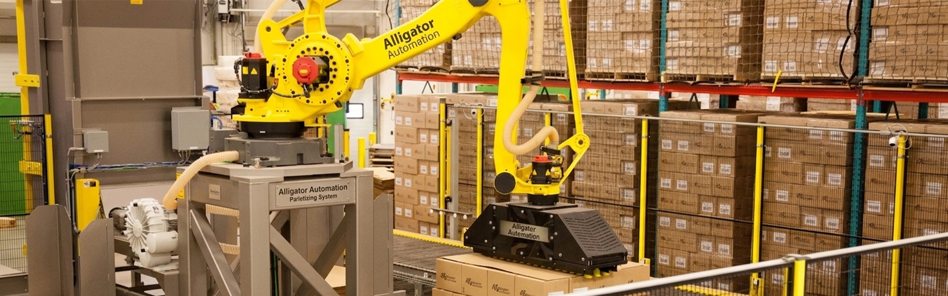 automated palletizer machine in manufacturing warehouse