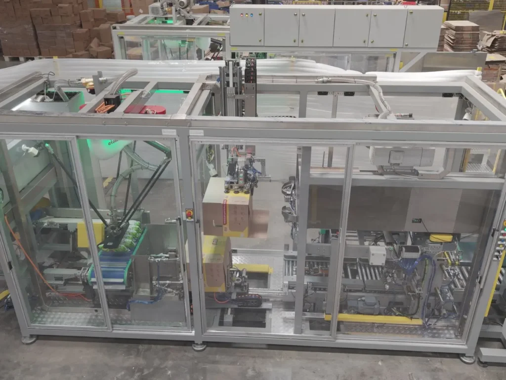 Food packaging automation system with case packing machinery, carton handling, and enclosed robotic equipment for end-of-line packaging.
